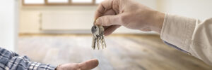 realtor giving house keys to tenant